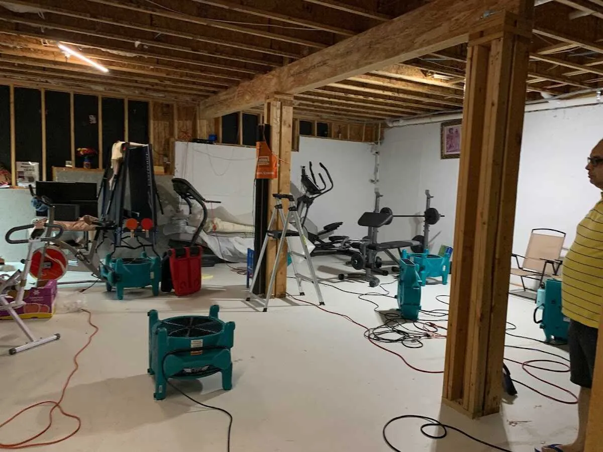 Basement drying equipment setup for Contents Cleaning & Restoration in Penn Forest